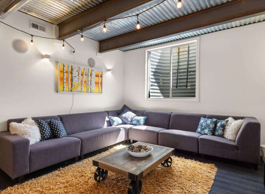 This cozy living space features a stylish sectional sofa, perfect for relaxing and entertaining.