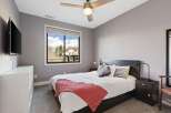 This bedroom offers a cozy and inviting atmosphere, perfect for relaxation.