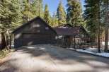Nestled amidst towering trees, this stunning property offers a serene retreat.