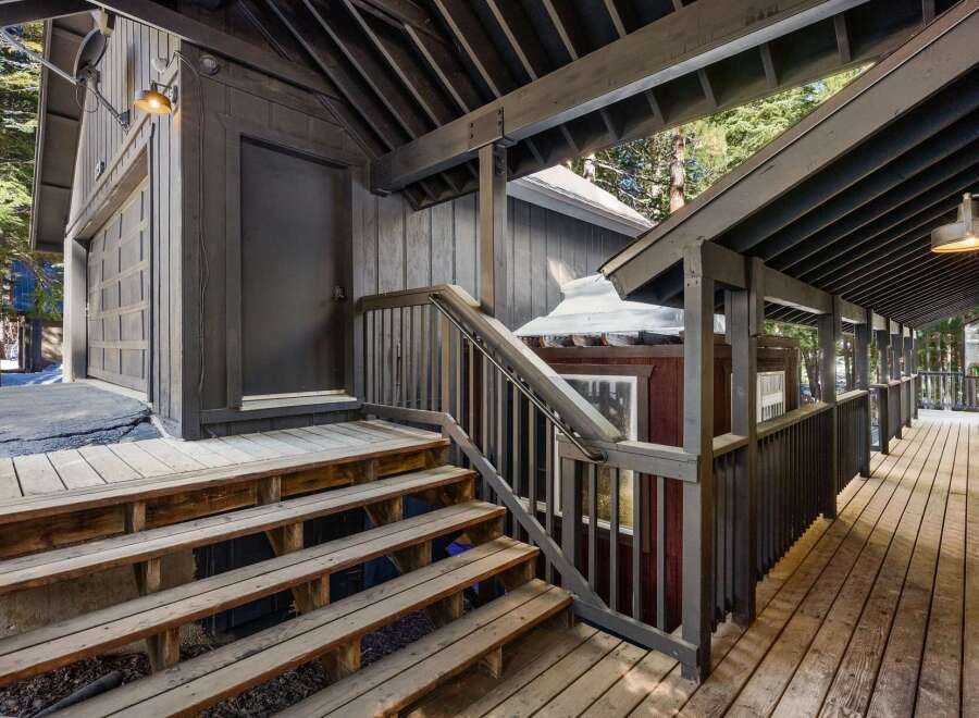 Discover the charm of this property, featuring a welcoming wooden deck and stairs.