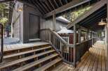 Discover the charm of this property, featuring a welcoming wooden deck and stairs.