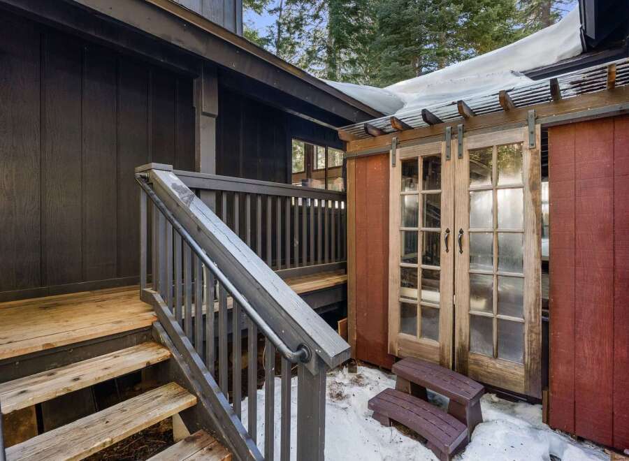 Discover the charm of this stunning property, featuring a beautifully designed exterior with rustic wooden accents.