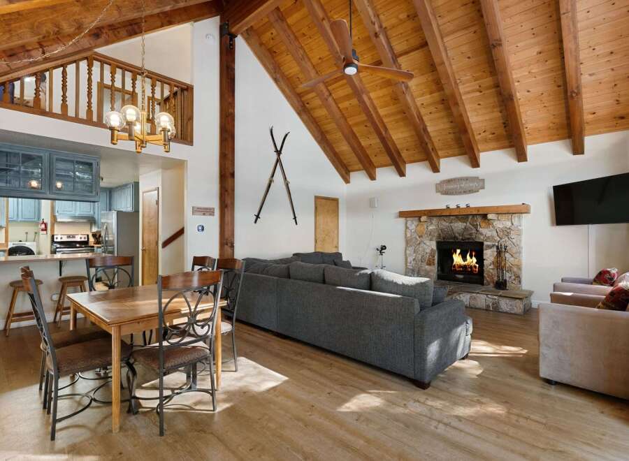 Experience the warmth and charm of this stunning property, featuring a cozy fireplace and a spacious living area perfect for gatherings.