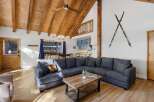 Discover the charm of this stunning property featuring a cozy living room with a large sectional sofa, perfect for gatherings.