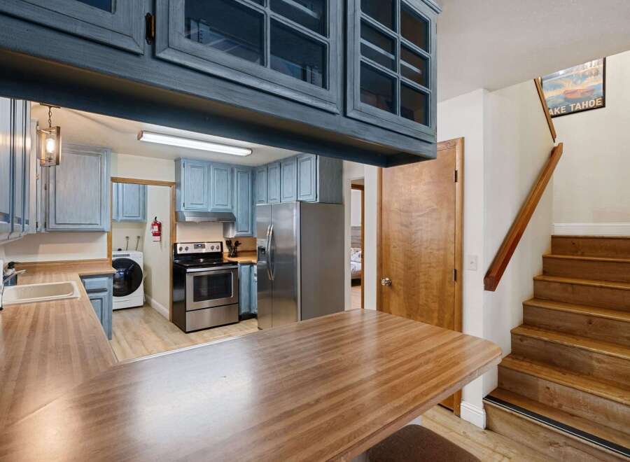 Step into this charming kitchen, featuring a stylish blend of modern and rustic elements.