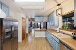 This stunning kitchen boasts a bright and airy design, perfect for culinary enthusiasts.