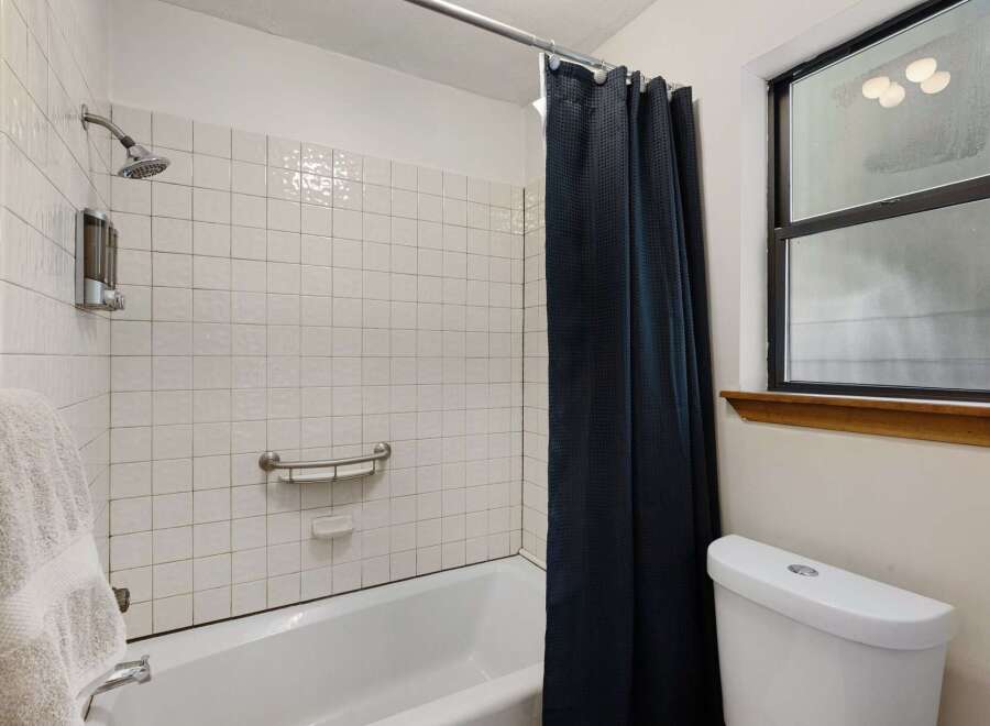 Step into this inviting bathroom, featuring a clean and modern design.
