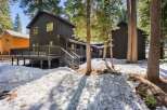 Nestled amidst towering trees, this stunning property offers a serene escape.