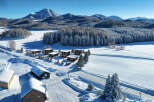Discover your dream winter retreat in this stunning property nestled amidst a snow-covered landscape.