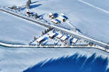 Discover a serene winter retreat in this stunning aerial view.