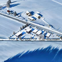 Discover a serene winter retreat in this stunning aerial view.