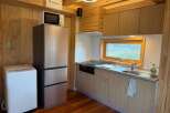 This cozy kitchen features modern appliances and ample storage, perfect for preparing meals.