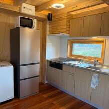 This cozy kitchen features modern appliances and ample storage, perfect for preparing meals.