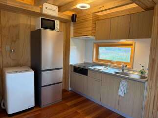 This cozy kitchen features modern appliances and ample storage, perfect for preparing meals.