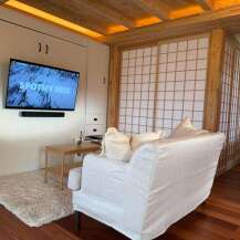 This cozy living space features a modern design with a touch of natural elements.