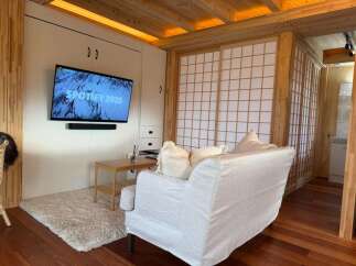 This cozy living space features a modern design with a touch of natural elements.