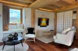Step into this cozy retreat featuring a stylish living area with a modern TV setup and comfortable seating.
