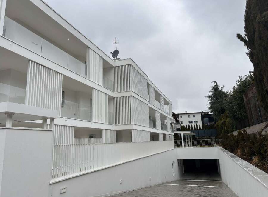 Discover modern living in this stunning white apartment building.