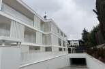 Discover modern living in this stunning white apartment building.