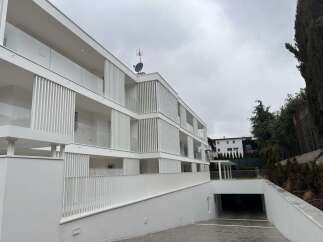 Discover modern living in this stunning white apartment building.