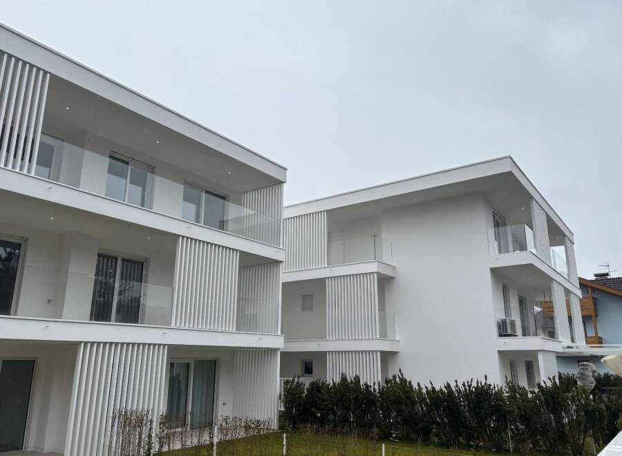 Discover modern living in these stunning white apartment buildings.