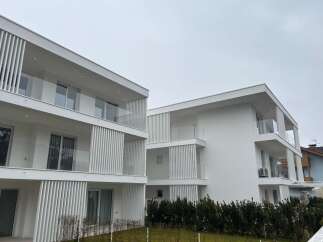 Discover modern living in these stunning white apartment buildings.