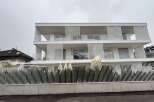 Discover modern living in this stunning white multi-story property.