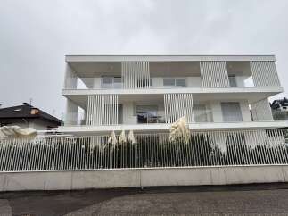 Discover modern living in this stunning white multi-story property.