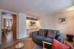 This cozy living space features a comfortable sofa, perfect for relaxing after a day on the slopes.