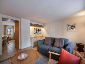 This cozy living space features a comfortable sofa, perfect for relaxing after a day on the slopes.