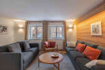 This cozy living room boasts a modern design with a touch of rustic charm.