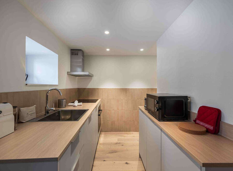 This modern kitchen boasts sleek design and functionality.
