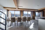Experience luxury living in this stunning property, featuring a spacious dining area with breathtaking mountain views.