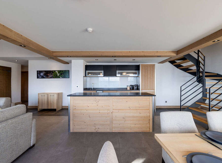 This stunning property boasts a modern kitchen with a large island, perfect for entertaining.