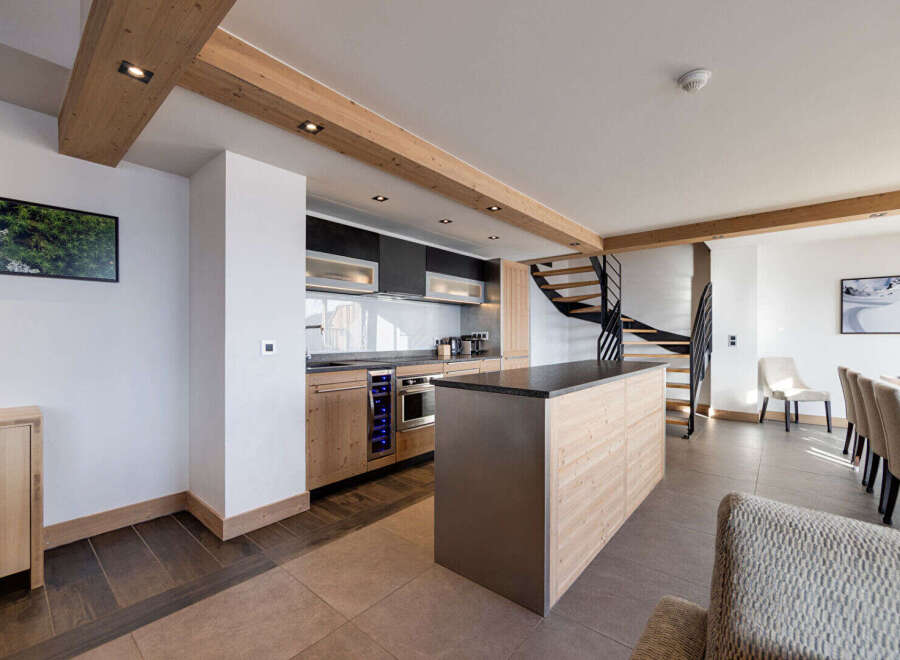 This stunning kitchen boasts a modern design with high-end appliances and ample counter space.