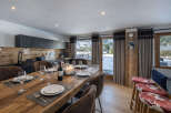 Experience luxury living in this stunning property, featuring a beautifully designed dining area perfect for entertaining.
