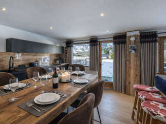 Experience luxury living in this stunning property, featuring a beautifully designed dining area perfect for entertaining.