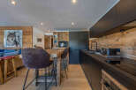 Experience the charm of this stunning kitchen, featuring a rustic wooden design and modern appliances.