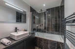 Step into modern luxury with this stunning bathroom.