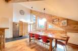 This stunning property boasts a spacious dining area, perfect for hosting gatherings.