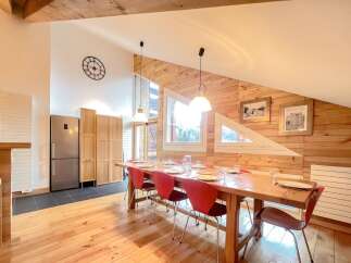This stunning property boasts a spacious dining area, perfect for hosting gatherings.