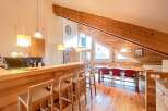Step into this stunning property featuring a modern kitchen with a stylish breakfast bar and sleek countertops.