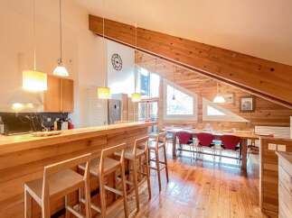 Step into this stunning property featuring a modern kitchen with a stylish breakfast bar and sleek countertops.