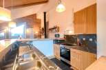 This stunning kitchen boasts a modern design with a touch of rustic charm.