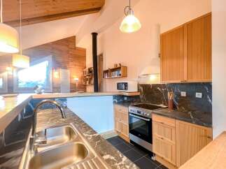 This stunning kitchen boasts a modern design with a touch of rustic charm.