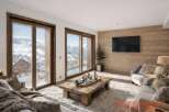 Experience the epitome of luxury living in this stunning property, boasting breathtaking mountain views visible through expansive windows.
