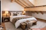 Experience the epitome of rustic elegance in this stunning bedroom.