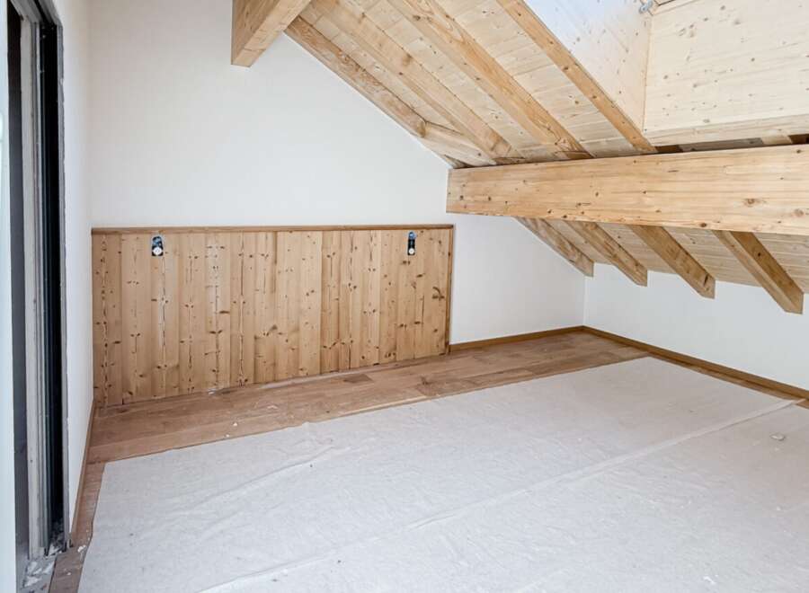 Discover the charm of this unique property, featuring a beautifully crafted wooden ceiling and walls that exude warmth and character.