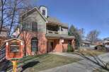 This charming property boasts a unique architectural design with a combination of brick and siding.