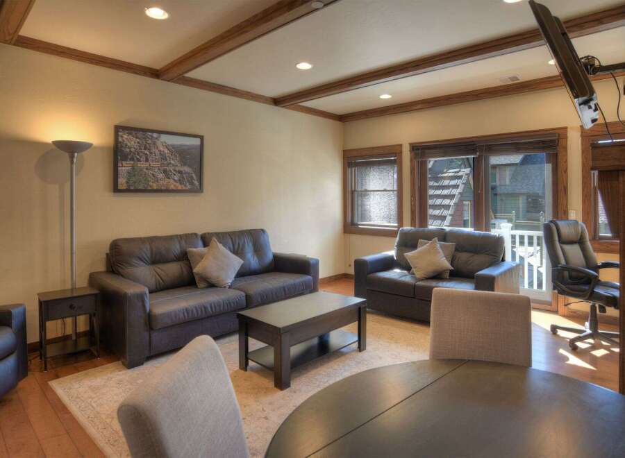 This stunning living space boasts a cozy atmosphere with its comfortable seating and inviting decor.